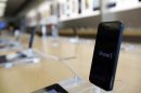 An iPhone 5 is pictured on display at an Apple Store in Pasadena, California July 22, 2013