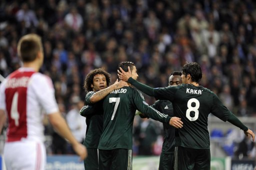 Real Madrid's Cristiano Ronaldo celebrates his goal with teammates during their Champions League Group D soccer match against Ajax Amsterdam at the Amsterdam Arena stadium