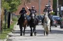 Cleveland mounted police patrol the streets as protesters march out of the city following the not guilty verdict for Cleveland police officer Brelo on manslaughter charges in Cleveland