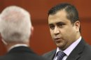 George Zimmerman talks to court security investigator Robert Hemmert for a recess after a jury question at the Seminole County Criminal Justice Center in Sanford Florida