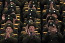 North Korean soldiers applaud during a mass rally organized to celebrate the success of a rocket launch that sent a satellite into space on Kim Il Sung Square in Pyongyang, North Korea, Friday, Dec. 14, 2012. As the U.S. led international condemnation of what it calls a covert test of missile technology, top North Korean officials denied the allegations and maintained the country's right to develop its space program. (AP Photo/Ng Han Guan)