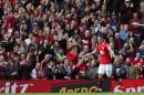Manchester United's Angel Di Maria celebrates after scoring against Everton during their English Premier League soccer match at Old Trafford Stadium, Manchester, England, Sunday Oct. 5, 2014. (AP Photo/Jon Super)