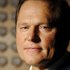 FILE - Sports agent Scott Boras poses for a portrait in the lobby of the Boras Corporation headquarters in Newport Beach, Calif., in this Sept. 5, 2008 file photo. According to an analysis done by a tax lawyer on the staff of agent Scott Boras, a player with a $10 million salary and average deductions who plays in Florida and is a resident of that state will see his taxes rise from $3.45 million this year to $4.09 million next year under current law. If traded to the Blue Jays, that player's 2013 tax would rise to $4.27 million. And if dealt to a California team, the tax would go up to $4.4 million. (AP Photo/Carlos Delgado)