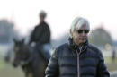 Trainer Bob Baffert watches horses workout at Churchill Downs Tuesday, April 28, 2015, in Louisville, Ky. (AP Photo/Charlie Riedel)