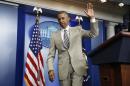 U.S. President Obama departs the White House Press Briefing Room after addressing reporters in Washington