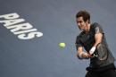 Britain's Andy Murray returns a ball to Bulgaria's Grigor Dimitrov during the third round match at the ATP World Tour Masters 1000 indoor tennis tournament on October 30, 2014 in Paris