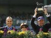 Owner of 'Pounced' Lady Serena Rothschild poses with her son Nat Rothschild and Los Angeles Dodgers baseball manager Joe Torre at Santa Anita Park in Arcadia