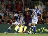 Barcelona's Messi controls the ball against Real Sociedad players during their Spanish first division soccer match at Nou Camp stadium in Barcelona