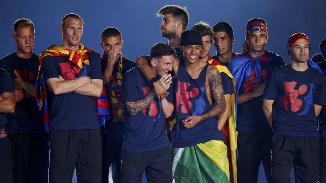 Barcelona&#39;s Messi shares a laugh with Neymar along with their team mates and staff members during celebration parade in Barcelona
