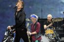 Mick Jagger, left, Keith Richards, center, and Charlie Watts of the Rolling Stones perform on the kick-off of the band's "50 and Counting" tour at the Staples Center on Friday, May 3, 2013 in Los Angeles. (Photo by Chris Pizzello/Invision/AP)