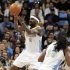 Denver Nuggets guard Ty Lawson, back, takes to the air to pull in the ball as forward Kenneth Faried looks on against the Los Angeles Lakers in the first quarter of Game 3 of the teams' first-round NBA playoff series in Denver on Friday, May 4, 2012. (AP Photo/David Zalubowski)