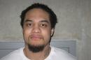 This Feburary 2012 photo, provided by the Utah Department of Corrections, shows Siale Angilau. A U.S. marshal shot and critically wounded Angilau on Monday, April 21, 2014, in a new federal courthouse after Angilau rushed the witness stand with a pen at his trial in Salt Lake City, authorities said. Angilau was one of 17 people named in a 29-count racketeering indictment filed in 2008 accusing gang members of conspiracy, assault, robbery and weapons offenses. The FBI said Angilau died Monday at the hospital. (AP Photo/Utah Department of Corrections)