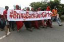 Nigerians take part in a protest demanding for the release of secondary school girls abducted from the remote village of Chibok, in Asokoro, Abuja
