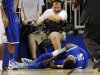 A cameraman grimmaces after a collision with Kentucky forward Nerlens Noel (3) during the second half of an NCAA college basketball game against Florida in Gainesville, Fla., Tuesday, Feb. 12, 2013. Noel injured his left knee and did not return. Florida won 69-52. (AP Photo/Phil Sandlin)