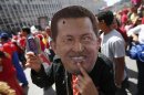 A supporter of Venezuela's President Hugo Chavez wears a mask depicting him during a rally in Caracas