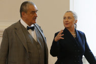 Czech Republic's Foreign Minister Karel Schwarzenberg, left, and US Secretary of State Hillary Rodham Clinton, right, arrive for their press conference in Prague, Czech Republic, Monday, Dec. 3, 2012. Secretary of State Clinton is lobbying the Czech Republic authorities to approve an American contract bid for an expansion of a nuclear power plant. (AP Photo/Petr David Josek)