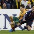 Australia's Matt McKay fights for the ball with Japan's Atsuto Uchida during their 2014 World Cup qualifying soccer match in Brisbane