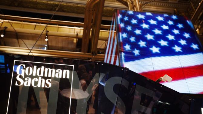 The Goldman Sachs logo is displayed on a post above the floor of the New York Stock Exchange in this file photo