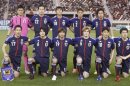 Japan's players pose for a group picture before their international friendly soccer match against Canada in Doha