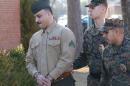 Cpl. Wassef Hassoun is escorted to the courtroom on Camp Lejeune in Jacksonville, N.C., Monday, Feb. 9, 2015, for the beginning of his court martial trial. The U.S. Marine who vanished from his post in Iraq a decade ago and later wound up in Lebanon chose Monday to have his case decided by a military judge instead of a jury. (AP Photo/The Daily News, John Althouse)