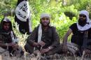 An image grab uploaded on June 19, 2014 shows Abu Muthanna al-Yemeni (C), believed to be Nasser Muthana, a 20-year-old man from Cardiff, Wales, speaking in a video from an undisclosed location