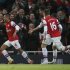 Arsenal's Theo Walcott celebrates after scoring against Liverpool during their English Premier League soccer match at the Emirates Stadium in London