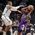 Brooklyn Nets C.J. Watson tries to block Sacramento Kings Aaron Brooks in their NBA basketball game in New York