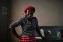 Haitian migrant, Naomi Josil, 29, poses for a photo inside the kitchen of the Juventud 2000 shelter after leaving Brazil, where she relocated to after Haiti's 2010 earthquake, in Tijuana, Mexico