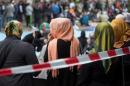 Muslim women wait after Friday prayers on Skalitzer Strasse in Berlin