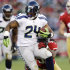 Seattle Seahawks running back Marshawn Lynch (24) rushes past San Francisco 49ers safety Dashon Goldson (38) during the second quarter of an NFL football game in San Francisco, Thursday, Oct. 18, 2012. (AP Photo/Marcio Jose Sanchez)