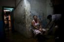 Yolanda Sanchez sits in her home in Havana