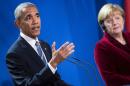 US President Barack Obama (L) speaks while German Chancellor Angela Merkel listens during a press conference after their meeting at the chancellery in Berlin on November 17, 2016