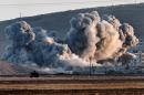 Smoke rises during airstrikes on the Syrian town of Ain al-Arab, known as Kobane by the Kurds, on October 8, 2014
