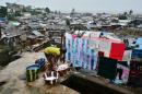 A woman washes clothes in Freetown, Sierra Leone, on August 13, 2014