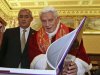 Pope Benedict XVI exchanges gifts with Guatemala's President Otto Perez Molina,  during a private audience at Vatican, Saturday, Feb. 16, 2013. (AP Photo/Alessandra Tarantino,  pool)