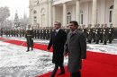 Armenian President Sargsyan walks with Iran's President Ahmadinejad during a welcoming ceremony in Yerevan