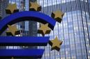 The euro sculpture is seen outside the headquarters of the European Central Bank in Frankfurt