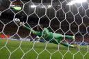 Netherlands' goalkeeper Tim Krul makes a save on a shot by Costa Rica's Michael Umana during a penalty shootout in extra time during the World Cup quarterfinal soccer match at the Arena Fonte Nova in Salvador, Brazil, Saturday, July 5, 2014. The Netherlands defeated Costa Rica 4-3 in penalties after a 0-0 tie. (AP Photo/Wong Maye-E)