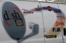 The Dish Network logo on the side of installers truck is seen in Denver