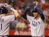 Tampa Bay Rays' Carlos Pena, right, is congratulated by Jose Lobaton  after hitting a two run home run in the eighth inning of a baseball game against the Los Angeles Angels in Anaheim, Calif., on Saturday, Aug. 18, 2012. (AP Photo/Christine Cotter)