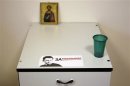 A sticker bearing the image of Russian opposition leader and anti-graft blogger Navalny is seen in his office in the city of Kirov