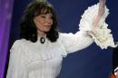 Loretta Lynn waves after performing the song "Miss being Mrs." at the 39th annual Academy of Country..