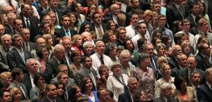 People look on during opening session of the two-day …