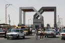 Vehicles drive through the Rafah border crossing point in the southern Gaza Strip on September 19, 2013