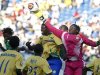 Gabon's goalkeeper Didier Ovono reaches for the ball during their African Nations Cup soccer match against Zambia at Ombaka stadium in Benguela