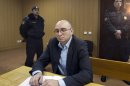 Dmitry Kratov, sits in a court, in Moscow, Russia, Friday, Dec. 28, 2012. The Tverskoy court on Friday will rule in the case of Dmitry Kratov, formerly deputy chief physician in the Butyrskaya prison, the only official charged with the lawyer's death. The Moscow court is expected to hand down a verdict on Friday for the first and only official charged with the death of whistleblowing lawyer Sergei Magnitsky in a case his family dismissed as sham and humiliation. (AP Photo/Misha Japaridze)
