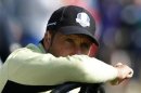 Team Europe captain Olazabal watches play on the eighth green during the afternoon four-ball round at the 39th Ryder Cup matches at the Medinah Country Club