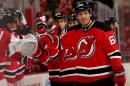 Jaromir Jagr of the New Jersey Devils celebrates with teammates on the bench on February 27, 2014 in Newark, New Jersey