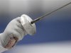 A fencer holds up a foil during a practice session at the ExCel venue before the start of the London 2012 Olympic Games