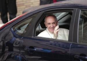 Pope Francis waves as he leaves at the end of a private visit at the Church of the Gesu in Rome
